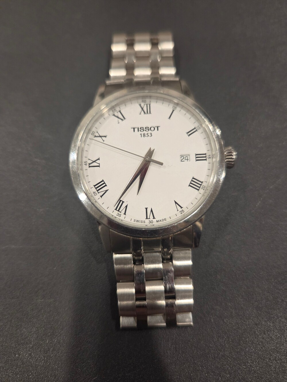 Tissot T129410 A Stainless Steel Watch White Dial Roman Numerals Date Window